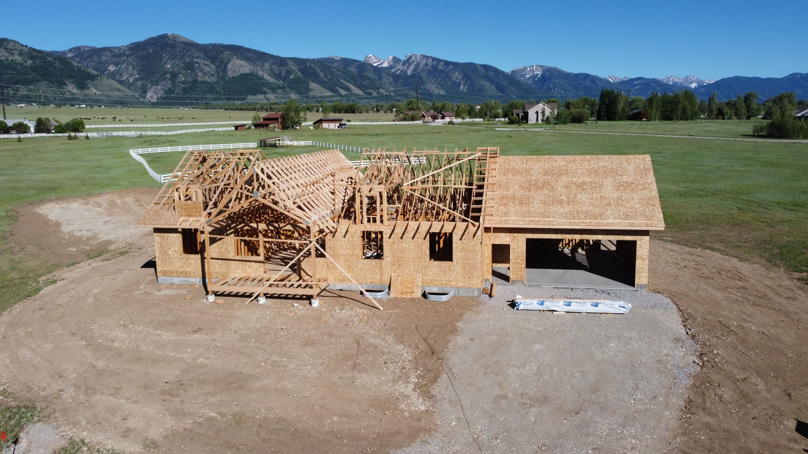 Aerial drone photo of the 109 Teton Way home with roof trusses set, June