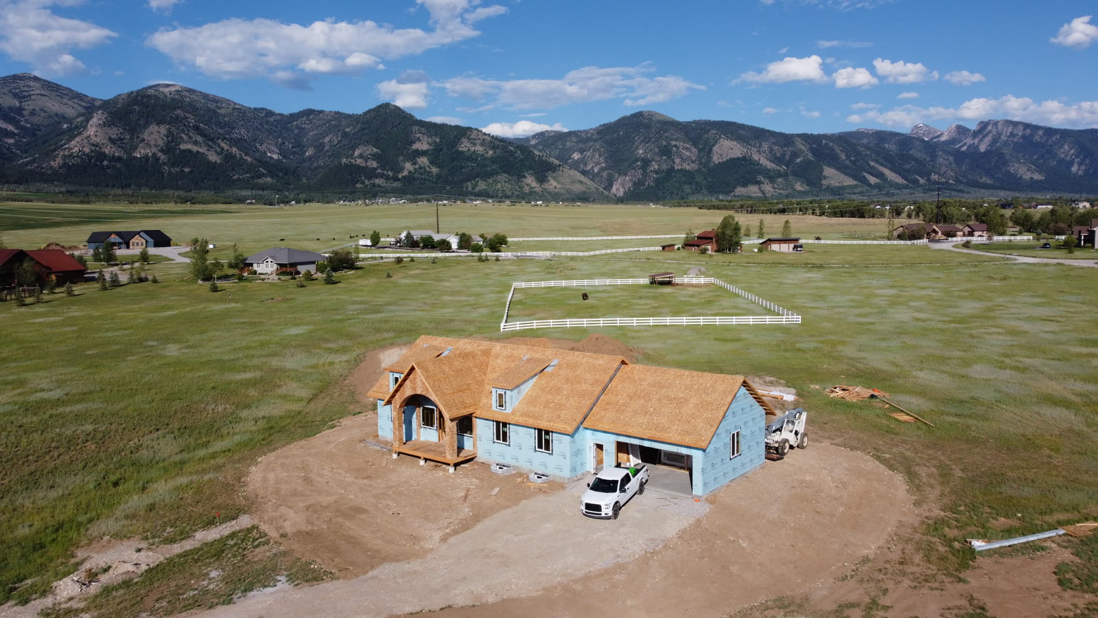 Aerial drone photo of the 109 Teton Way home dried in with house wrap, June