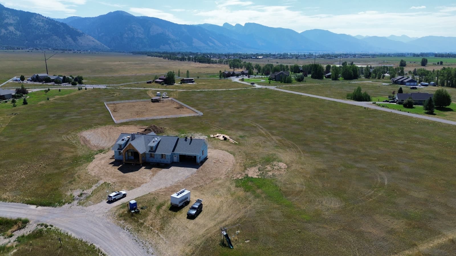 Aerial drone photo of the 109 Teton Way home with roof shingled, July