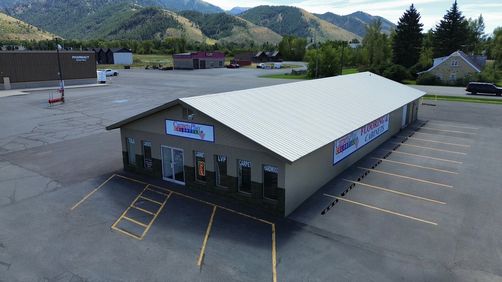 Aerial drone photo of a retail storefront roofline and signage