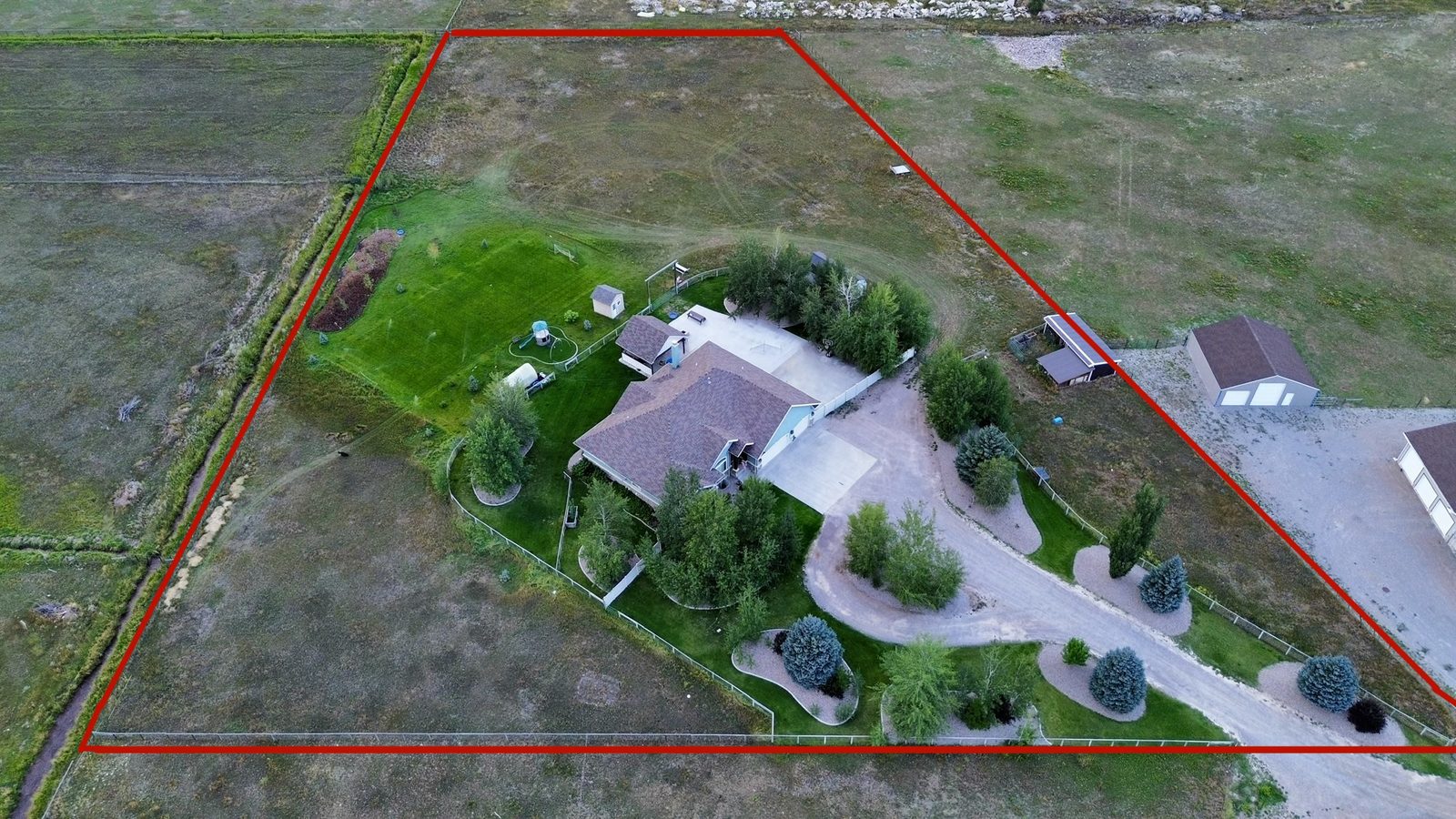 Drone photo of a property with boundary line overlay for a real estate listing